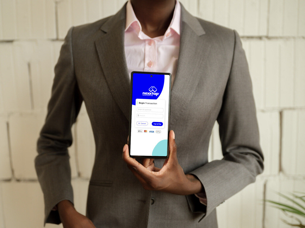 51-Nexxtap-businesswoman-with-phone-in-the-office-workspace