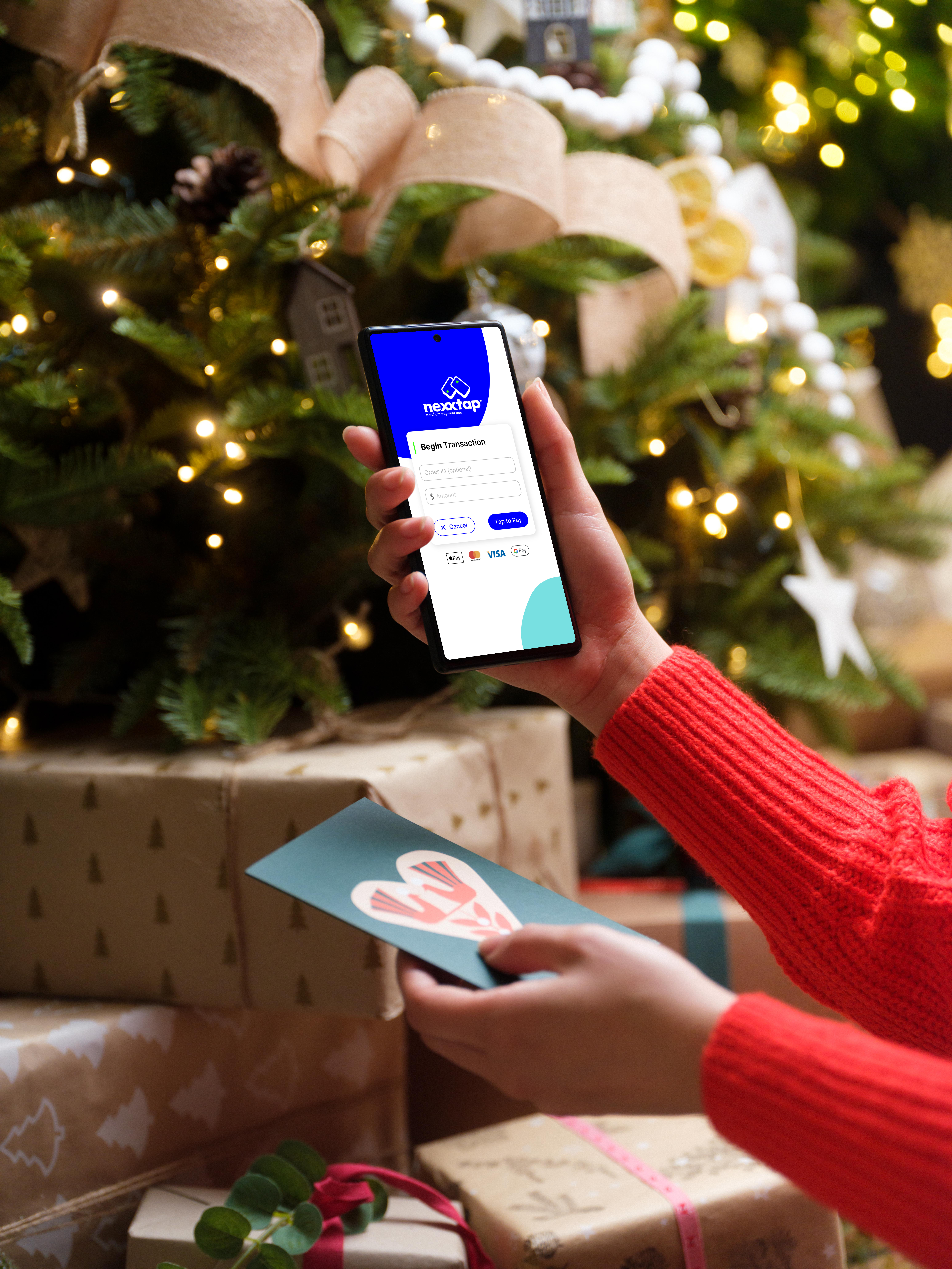 Nexxtap-woman-in-red-sweater-holding-smartphone-and-gift-card